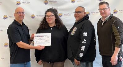From left: Michael Jackson, partner at PACT®, Jocelyne Sanchez, Rafael Sanchez, Jocelyne’s father, and Warwick Valley Economics teacher Mr. Doug Torgersen celebrate the culmination of the local competition.