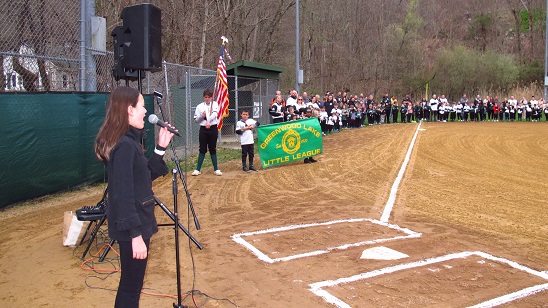 Skylar Clifford, 12, sings the National Anthem for the opening ceremony