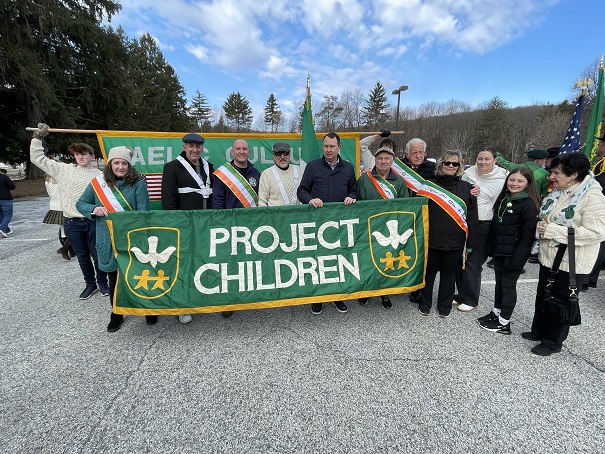 Town Supervisor Jesse Dwyer stands with member of Project Children