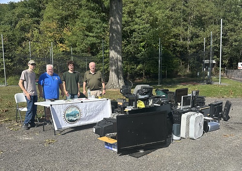 Elks Club Jim Clifford and young Village resident helping to assemble the bench